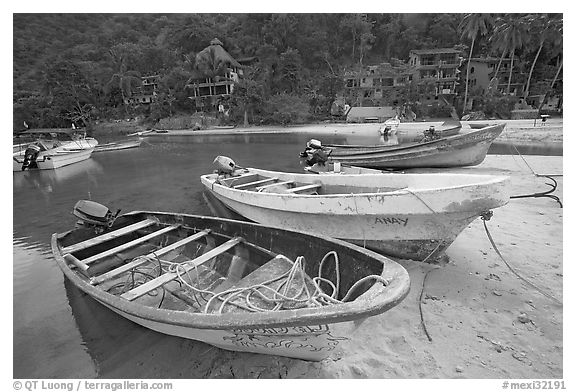 Small boats beached in a lagoon in fishing village, Boca de Tomatlan, Jalisco. Jalisco, Mexico