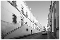 Car in street at dawn with Zacatecas Museum. Zacatecas, Mexico (black and white)