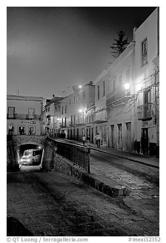 Juarez street and subterranean street with bus at night. Guanajuato, Mexico (black and white)