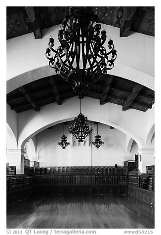Ballroom and intricate ironwork in heavy chandeliers, Riviera Del Pacifico, Ensenada. Baja California, Mexico (black and white)