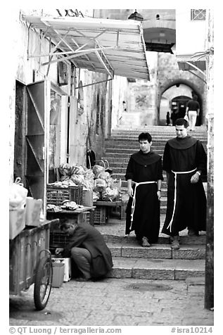 Two christian monks in a narrow alley. Jerusalem, Israel (black and white)