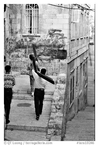 Men carrying crosses. Jerusalem, Israel (black and white)