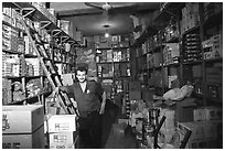 Man in a store, Hebron. West Bank, Occupied Territories (Israel) (black and white)