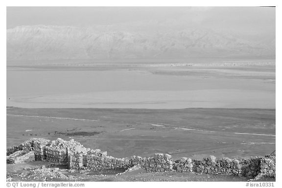 Ancient ruined walls of Masada and Dead Sea valley. Israel (black and white)