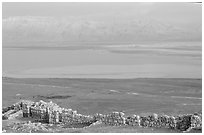 Ancient ruined walls of Masada and Dead Sea valley. Israel (black and white)