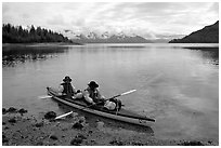Kayakers land in Hugh Miller Inlet. Glacier Bay National Park, Alaska (black and white)