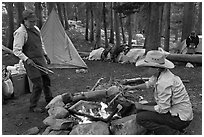 Women preparing food at camp, Le Conte Canyon. Kings Canyon National Park, California (black and white)