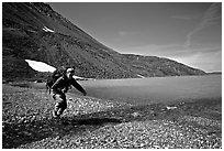 Jumping over a small stream next to Lake Turquoise. Lake Clark National Park, Alaska (black and white)