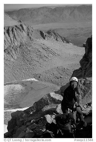 Woman gearing up to climb  East face of Mt Whitney. Sequoia National Park, California