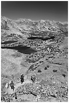 Hikers on trail above Saddlebag Lakes, John Muir Wilderness. Kings Canyon National Park, California (black and white)