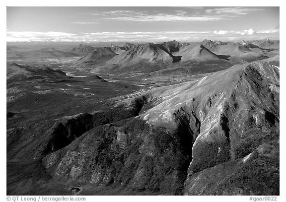 Aerial view of mountains with meandering Alatna river in the distance. Gates of the Arctic National Park (black and white)