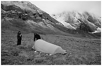Backpackers camp at the base of the Arrigetch Peaks. Gates of the Arctic National Park, Alaska (black and white)