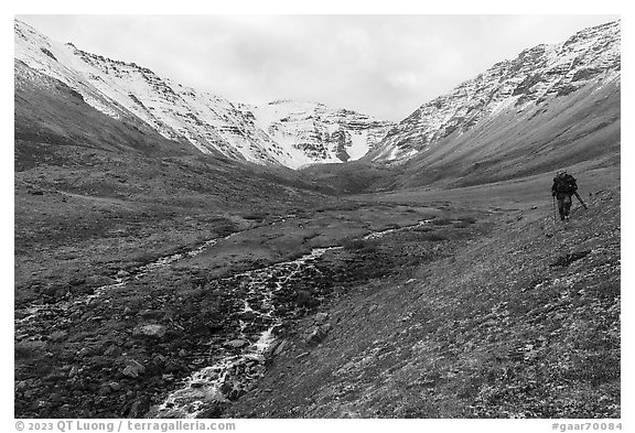 Hiker above stream, Three River Mountain. Gates of the Arctic National Park (black and white)