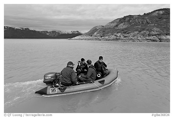 Film crew preparing for landing in a Zodiac. Glacier Bay National Park (black and white)