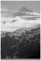 Pointed mountain with clouds hanging below. Glacier Bay National Park, Alaska, USA. (black and white)