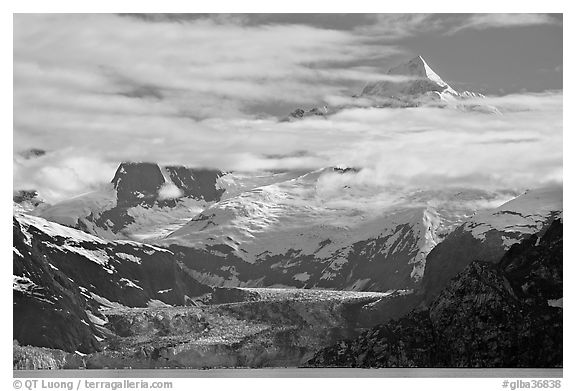 Pointed peaks of Fairweather range emerging from clouds. Glacier Bay National Park, Alaska, USA.