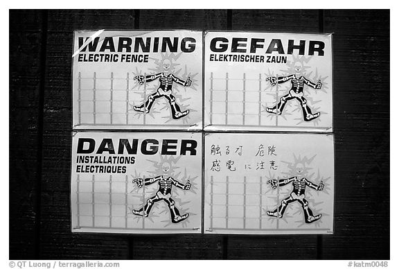 Sign in Brooks campground, warning of the electric fence used to keep the bears out. Katmai National Park (black and white)