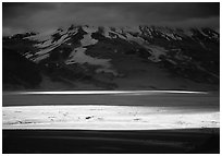 A break in the clouds illuminate the floor of the Valley of Ten Thousand smokes. Katmai National Park, Alaska, USA. (black and white)