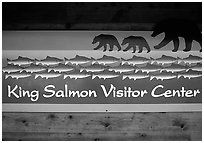 Bears and salmon on visitor center sign. Katmai National Park, Alaska, USA. (black and white)