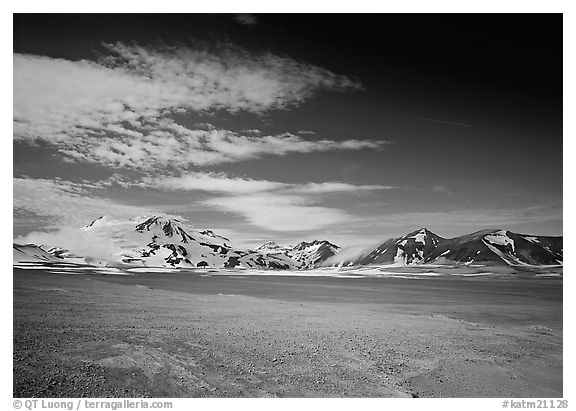 The desert-like floor of the Valley of Ten Thousand smokes is surrounded by snow-covered peaks such as Mt Meigeck. Katmai National Park (black and white)