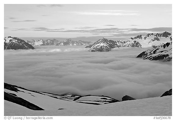 Peaks emerging from clouds at sunset. Kenai Fjords National Park (black and white)