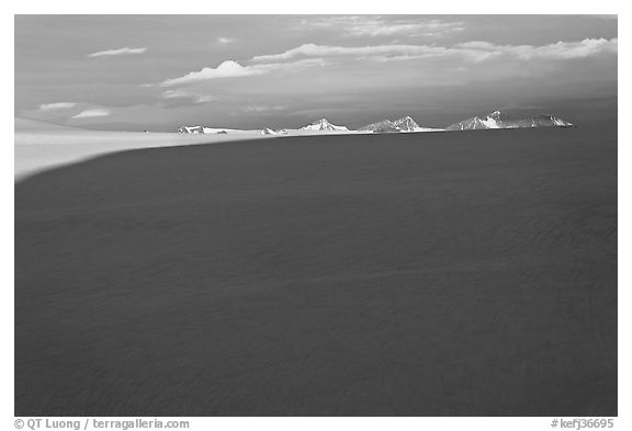 Distant mountains emerging from shadows over the Harding field. Kenai Fjords National Park (black and white)