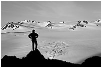 Man standing on overlook above Harding ice field, early morning. Kenai Fjords National Park, Alaska, USA. (black and white)