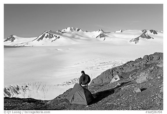 Tent and backpacker above the Harding icefield. Kenai Fjords National Park (black and white)