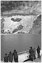 People watch  Northwestern glacier from deck of boat, Northwestern Lagoon. Kenai Fjords National Park, Alaska, USA. (black and white)