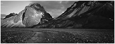 Stream, gravel bar, and mountains at sunset. Lake Clark National Park (Panoramic black and white)
