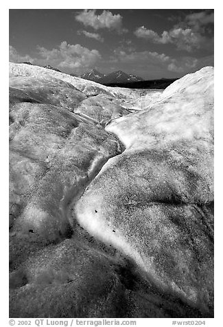 Ice, glacial creek on Root glacier, and mountains. Wrangell-St Elias National Park (black and white)