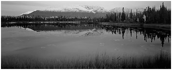 Pond and reflected mountains at dusk. Wrangell-St Elias National Park (Panoramic black and white)