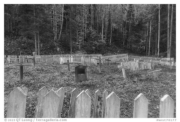 Headstone and wooden crosses at various angles, Kennecott cemetery. Wrangell-St Elias National Park (black and white)