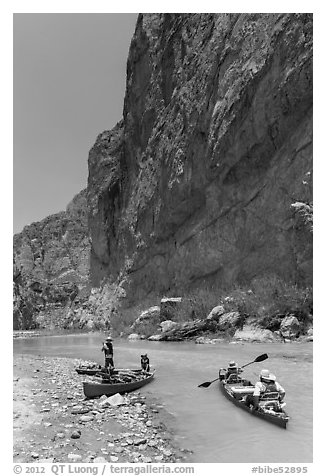 Canoeists bellow steep walls of Boquillas Canyon. Big Bend National Park (black and white)