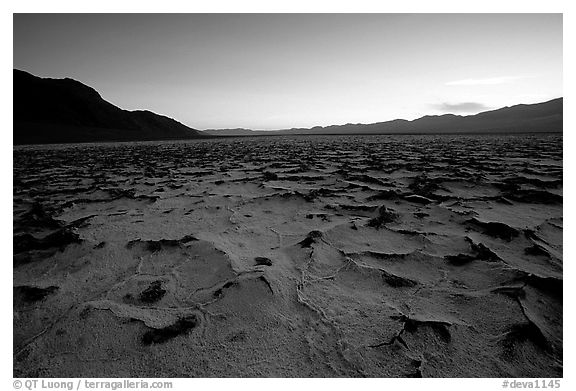 Evaporation patterns on salt flats near Badwater, dusk. Death Valley National Park, California, USA.