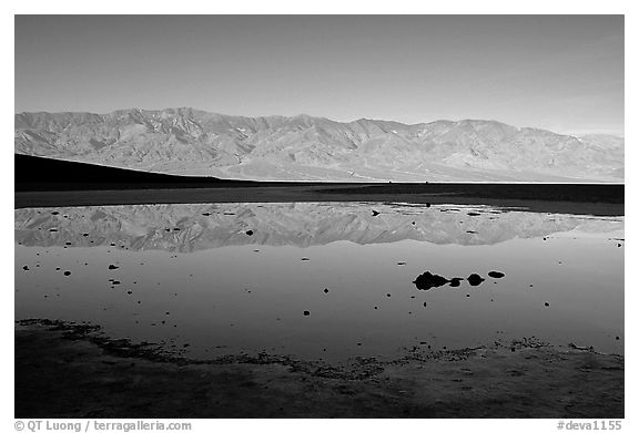 Panamint range reflection in Badwater pond, early morning. Death Valley National Park (black and white)