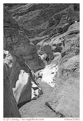 Hikers in slot, Mosaic canyon. Death Valley National Park (black and white)