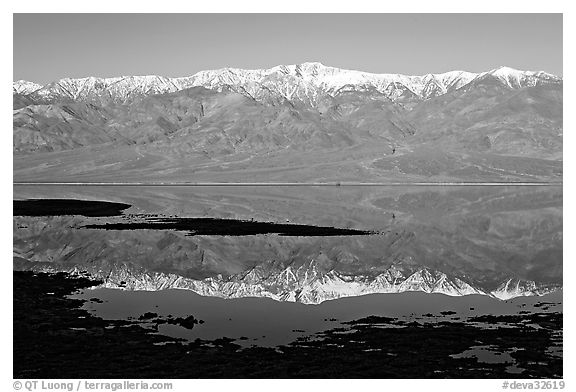 Telescope Peak and Panamint range reflected in a rare seasonal lake, early morning. Death Valley National Park (black and white)