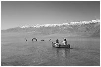 Canoe near the dragon in Manly Lake, below the Panamint Range. Death Valley National Park, California, USA. (black and white)