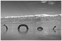 Dragon art installation in Manly Lake and Panamint range. Death Valley National Park, California, USA. (black and white)