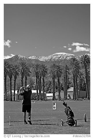 Golfer in Furnace Creek Golf course. Death Valley National Park (black and white)
