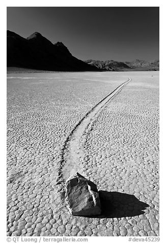Sailing rock and travel groove on the Racetrack. Death Valley National Park (black and white)