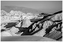 Twenty Mule Team Canyon and distant valley. Death Valley National Park ( black and white)