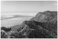 Hiker surveying view over mountains and plains. Guadalupe Mountains National Park, Texas, USA. (black and white)