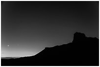 El Capitan profile and moon at dusk. Guadalupe Mountains National Park, Texas, USA. (black and white)