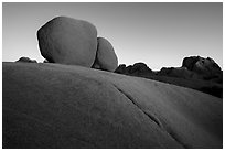 Twin boulders and crack at sunrise. Joshua Tree National Park ( black and white)