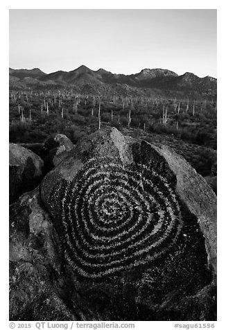 Spiral petroglyph and Tucson Mountains at sunset. Saguaro National Park (black and white)