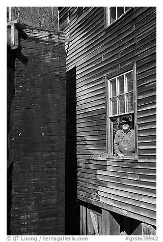 Miller standing at window, Mingus Mill, North Carolina. Great Smoky Mountains National Park, USA.