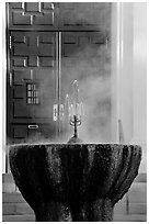 Fountain with thermal steam outside Park Visitor Center. Hot Springs National Park, Arkansas, USA. (black and white)