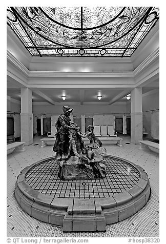 Statue of Desoto receiving gift from Caddo Indian maiden in mens bath hall. Hot Springs National Park (black and white)